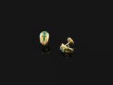 a pair of gold and emerald earrings