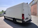 a white van that is parked in a parking lot