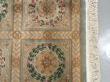 an image of a rug with a floral design on it