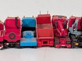 a lot of toy cars that are lined up together