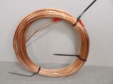 an image of a coil of copper wire on a table
