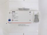 a white box with a label on it that is attached to a device