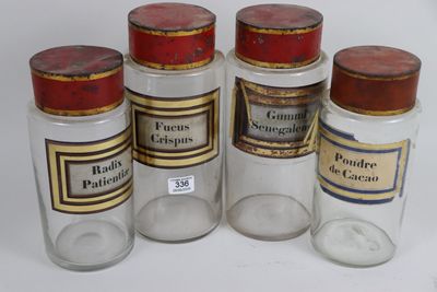 six glass jars with different types of medicine on a white surface