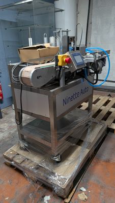 a machine that is sitting on a pallet in a warehouse