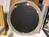 a picture of a large round black and white plate