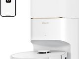 une photo d'une cafetière blanche avec un téléphone à côté