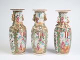 three vases with different designs on them on a white surface