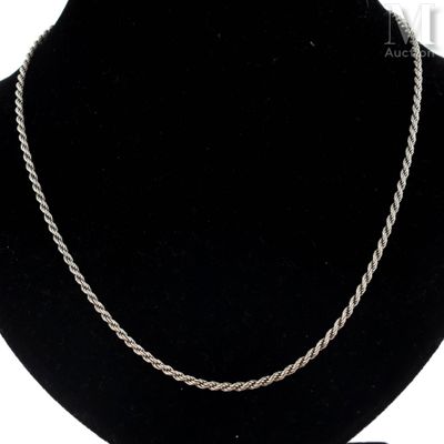 a close up of a necklace on a mannequin mannequin