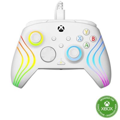 a close up of a controller on a white surface