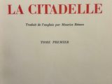 a white book with red writing on the cover