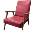 an image of a red leather chair on a white background