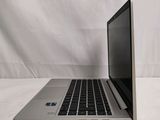 a laptop that is sitting on a white surface