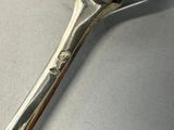 a spoon that has a fork on it on a table