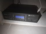 a radio that is sitting on top of a shelf