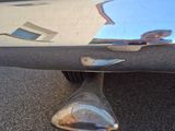 a close up of a car ' s tail end on the street