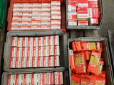boxes of cigarettes are stacked on top of each other on the floor