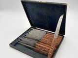 a box with a set of knives inside of it