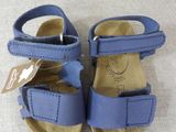 a pair of baby shoes with a tag on them