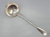 a close up of a spoon with a spoon handle on a table
