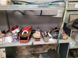 a shelf full of assorted items in a garage
