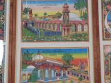 three framed pictures of a building with a clock tower and a clock tower