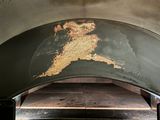 a wood burning oven with a map on it