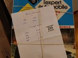 a pile of papers and a book on a table