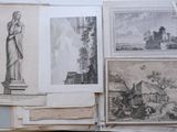 many different pictures of a statue on a table