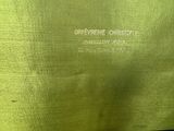 an image of a close up of a green bag with a name on it