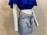 a mannequin wearing a blue top and denim skirt on a mannequin mannequin mannequin mannequin mannequin mannequin