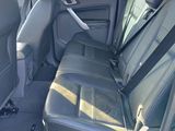 the back seats of a car are empty in a parking lot