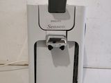 a picture of a white coffee maker on a counter