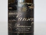 a bottle of wine that is sitting on a table