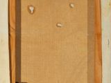 an old picture of a piece of cardboard with a hole in it