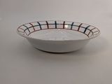 white bowl with red, blue, and white stripes on it