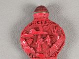 chinese red snuff bottle decorated with a dragon and a bird