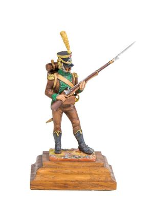 a figurine of a soldier in uniform holding a rifle