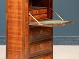 an old wooden cabinet with a marble top and drawers