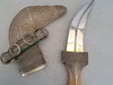 a knife and a knife holder on a table