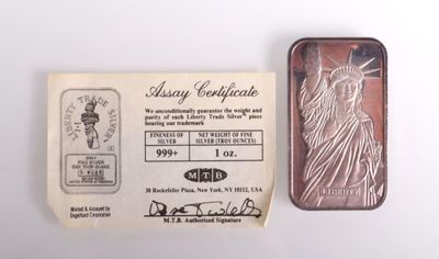 une image représentant un lingot d'argent sur lequel figure la statue de la Liberté