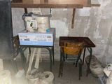 two stools and a table in a room that is under construction