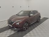 the nissan juke suv is parked in a clean room