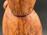 a small wooden object that is sitting on a table