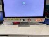 a white desk with a computer on top of it