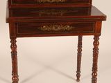 an old wooden desk with a drawer on top of it