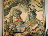 a tapestry hanging on the wall of a room