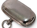 a silver case with a keychain attached to it