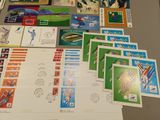 a table with many different stamps and stamps on it