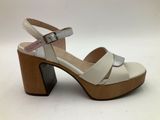 a close up of a woman ' s shoe on a white background