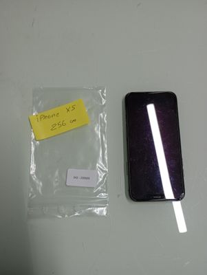 a phone that is sitting on a table next to a bag